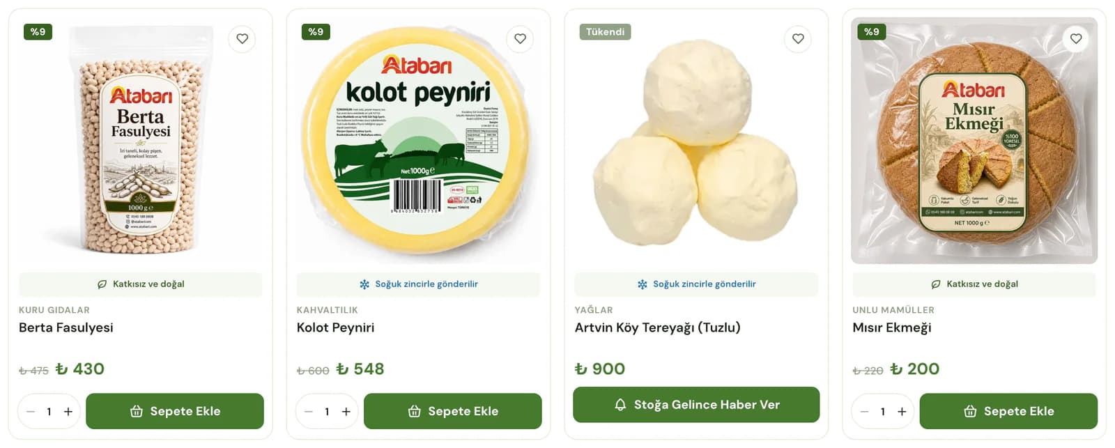 Best-seller cards on the Atabarı homepage: Berta beans and corn bread labelled additive-free and natural, Kolot cheese labelled as shipped cold-chain and a sold-out village butter with a notify-me button; discount badges, prices, quantity steppers and add-to-cart buttons.