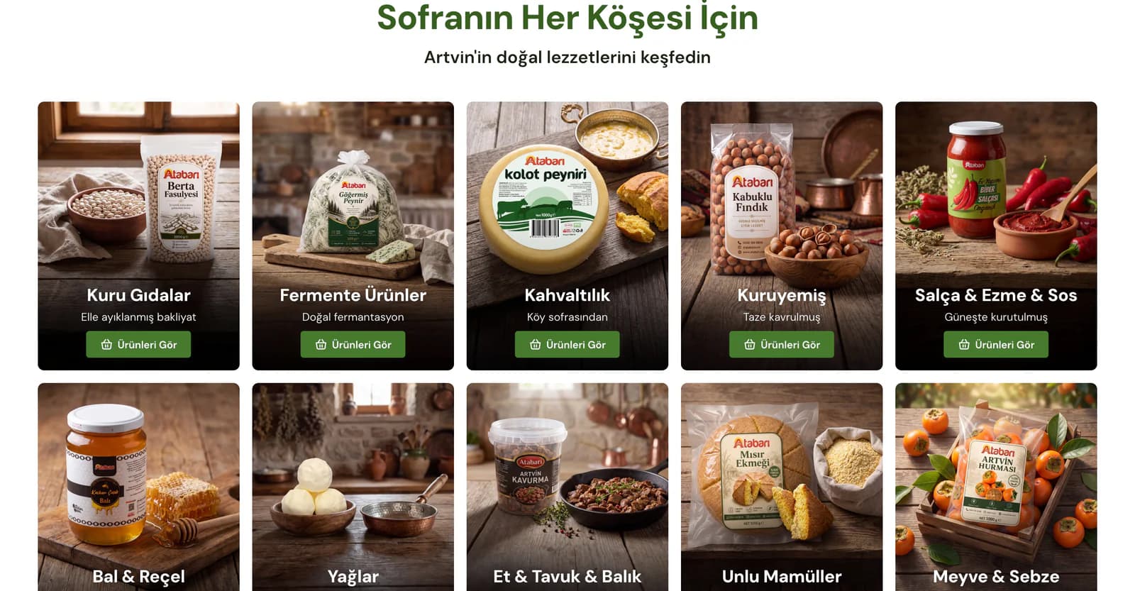 The Sofranın Her Köşesi İçin (for every corner of the table) area on the Atabarı homepage: category cards for dry goods, fermented foods, breakfast, nuts, sauces, honey and jam, oils, meat, bakery and produce, each with a table photo.