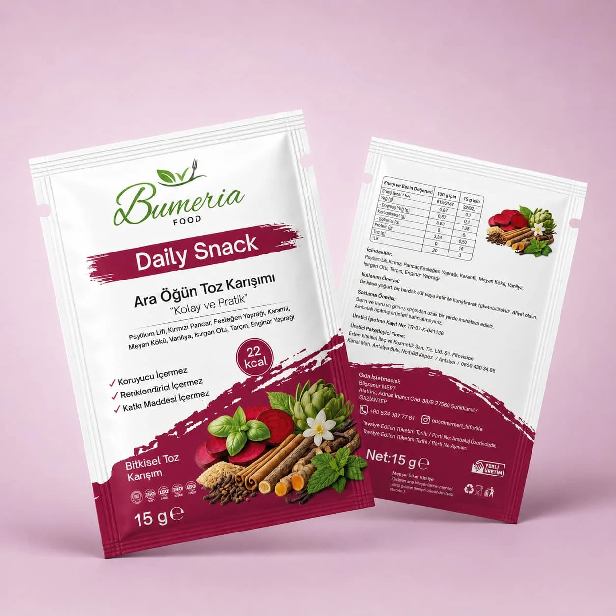 Bumeria Food Daily Snack ara öğün toz karışımı paketleri: açık pembe zeminde önden ve arkadan iki bordo şeritli paket, sebze ve baharat çizimleri.