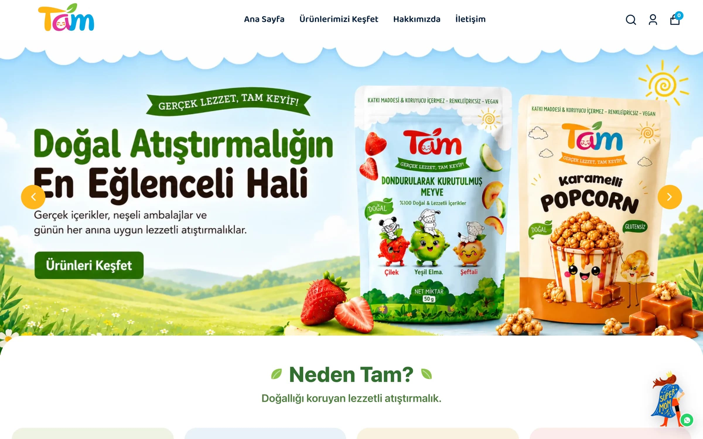 Tam'ın masaüstü ana sayfası: renkli Tam logosu ve Ana Sayfa, Ürünlerimizi Keşfet, Hakkımızda, İletişim menüsü; açılış slaytında yeşil çayır önünde Gerçek Lezzet, Tam Keyif! şeridi, Doğal Atıştırmalığın En Eğlenceli Hali başlığı, dondurularak kurutulmuş meyve ve karamelli popcorn ambalajları ve Ürünleri Keşfet düğmesi; altında Neden Tam? başlığı.