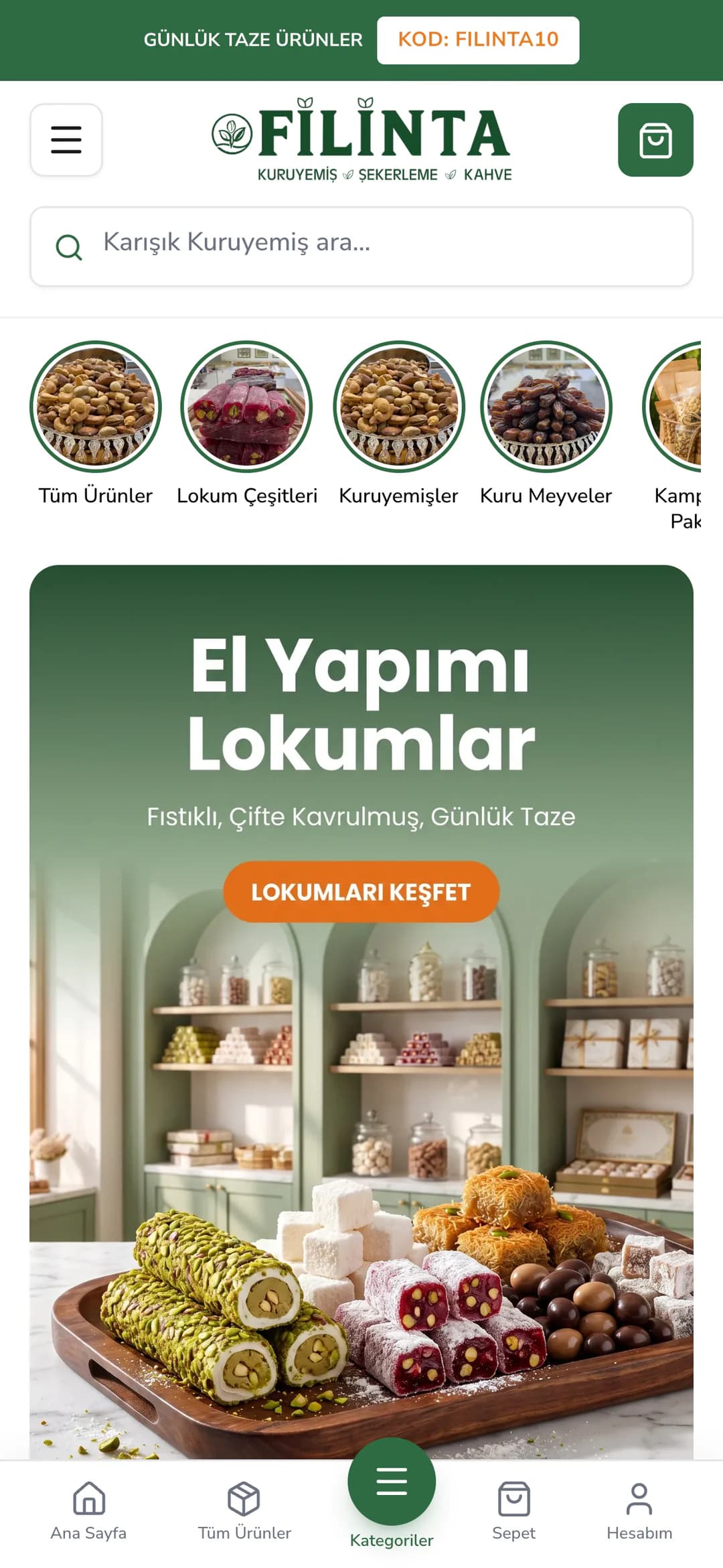 Filinta Kuruyemiş'in telefondaki ana sayfası: yeşil şeritte Günlük taze ürünler ve KOD: FILINTA10 rozeti, FİLİNTA logosu, sepet düğmesi ve Karışık Kuruyemiş ara... arama kutusu; altında Tüm Ürünler, Lokum Çeşitleri, Kuruyemişler ve Kuru Meyveler hikâye halkaları; açılışta lokum dükkânı rafları önünde El Yapımı Lokumlar başlığı, Fıstıklı, Çifte Kavrulmuş, Günlük Taze yazısı, turuncu Lokumları Keşfet düğmesi ve tepside lokumlar.