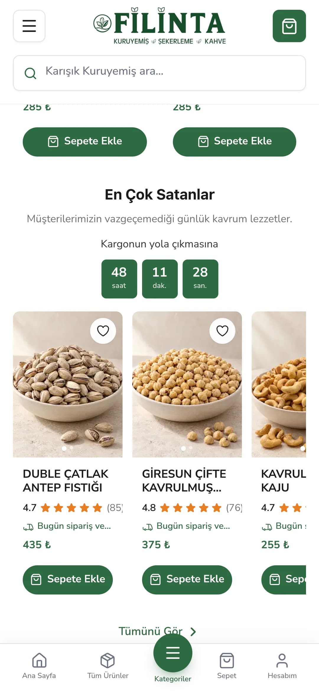 Filinta Kuruyemiş ana sayfasındaki En Çok Satanlar vitrini telefonda: Müşterilerimizin vazgeçemediği günlük kavrum lezzetler açıklaması, Kargonun yola çıkmasına yazısı ve saat, dakika, saniye kutuları; altında kaydırmalı şeritte Duble Çatlak Antep Fıstığı (435 ₺), Giresun Çifte Kavrulmuş Fındık (375 ₺) ve Kavrulmuş Kaju kartları, puanları ve Sepete Ekle düğmeleri.