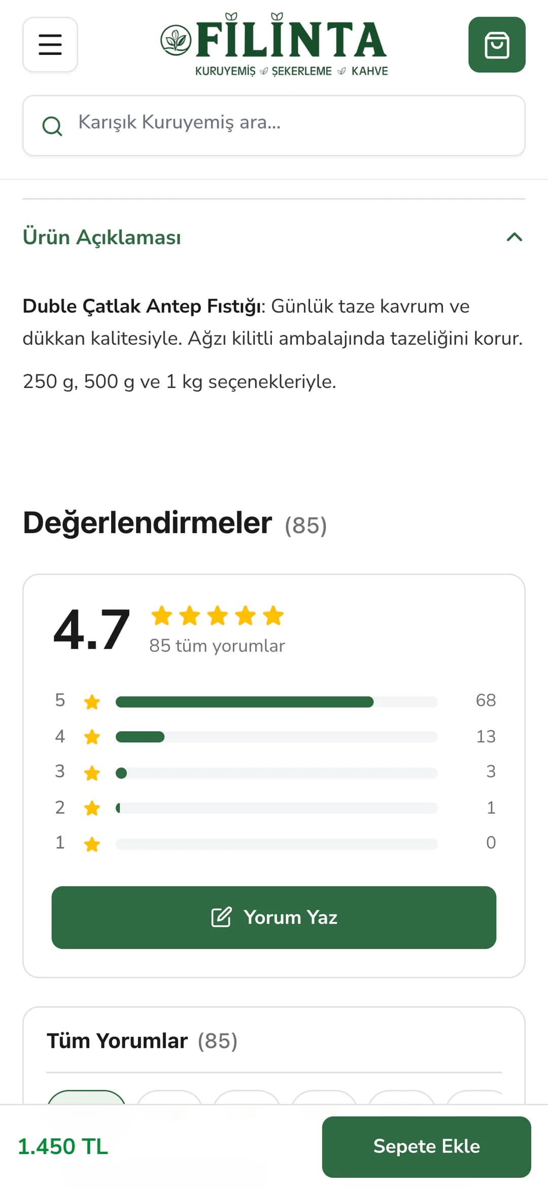 Duble Çatlak Antep Fıstığı ürün sayfasında telefonda açılan Ürün Açıklaması (günlük taze kavrum, ağzı kilitli ambalaj, 250 g, 500 g ve 1 kg seçenekleri) ve altında Değerlendirmeler (85) bölümünün puan özeti: 4.7, yıldız dağılımı çubukları ve Yorum Yaz düğmesi.