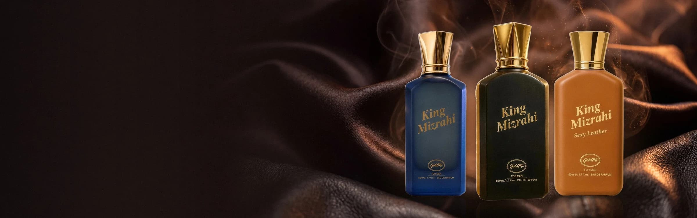 Goldmi King Mizrahi açılış görseli: koyu kahve deri ve duman önünde lacivert, siyah ve Sexy Leather etiketli taba renkli üç King Mizrahi şişesi.