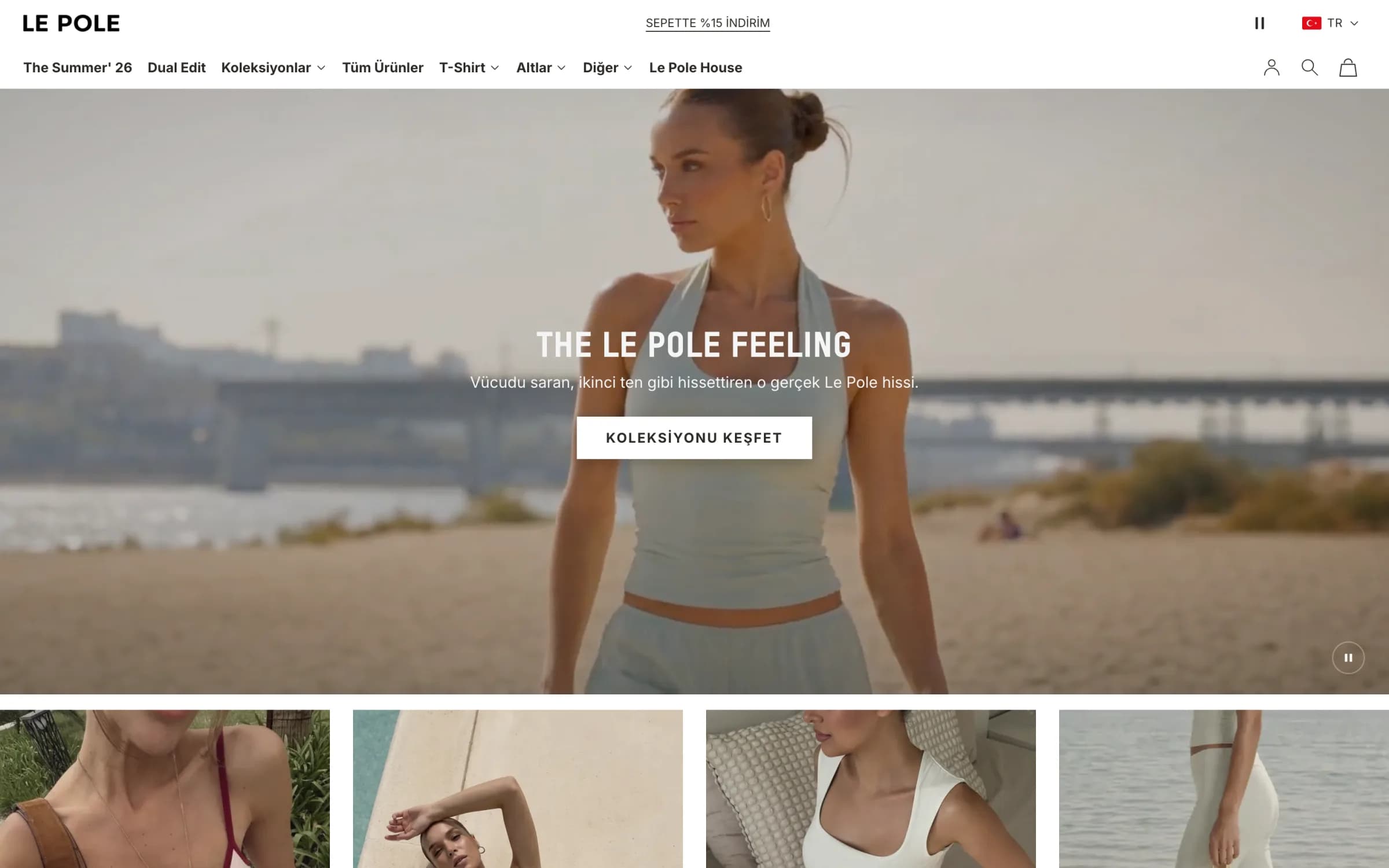 Le Pole'ün masaüstü ana sayfası: üstte LE POLE logosu, Sepette %15 İndirim duyurusu ve The Summer' 26, Dual Edit, Koleksiyonlar, Tüm Ürünler, T-Shirt, Altlar, Diğer, Le Pole House menüsü; açılış videosunda nehir kıyısında açık yeşil halter atlet giyen model, The Le Pole Feeling başlığı ve Koleksiyonu Keşfet düğmesi; altta koleksiyon kutuları.