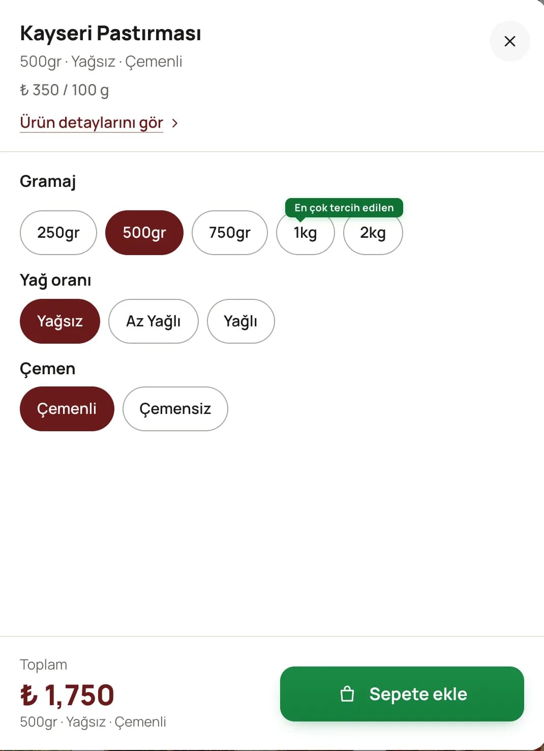 Ana sayfadaki pastırma kartından masaüstünde açılan seçim penceresinin yakın planı: Kayseri Pastırması, 500gr · Yağsız · Çemenli ve ₺ 350 / 100 g; Gramaj satırında 250gr, seçili 500gr, 750gr, En çok tercih edilen rozetli 1kg ve 2kg; Yağ oranı satırında seçili Yağsız, Az Yağlı ve Yağlı; Çemen satırında seçili Çemenli ve Çemensiz; altta ₺ 1,750 toplam ve yeşil Sepete ekle düğmesi.